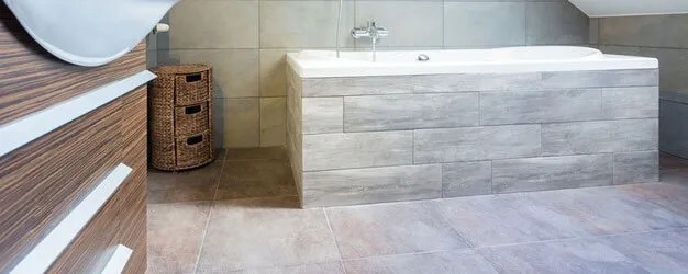 Bathroom with quartzite floor tiles — D and W SRQ, Sarasota