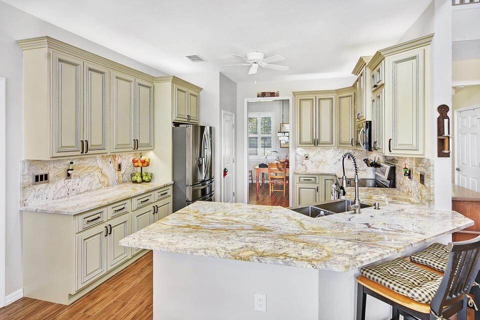 Yellow beige and black tone granite kitchen counter tops — D and W SRQ, Sarasota